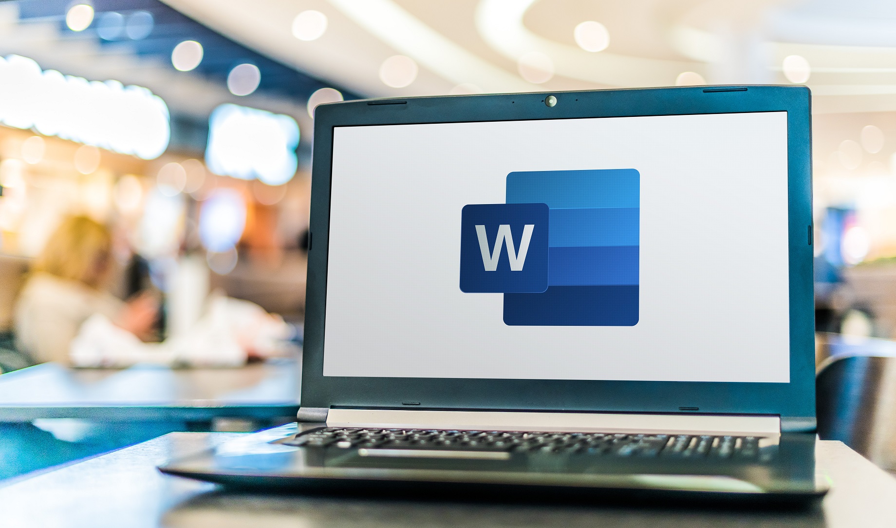 Laptop computer displaying logo of Microsoft Word Microsoft 365 - Microsoft Word